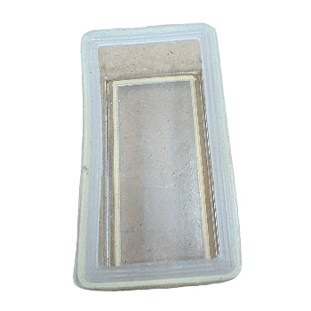 Rectangular air filter in a clear plastic packaging on a white background